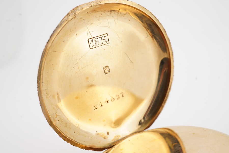 A lady's early 20th century engraved 18k lady's keyless open faced fob watch, with Roman dial, case diameter 32mm, gross weight 26 grams.